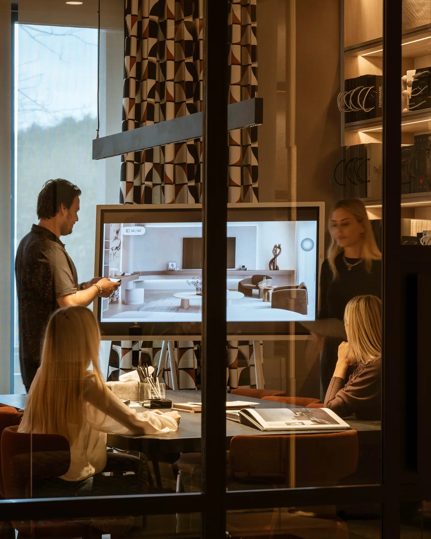 The design team going over a scheme together in the studio